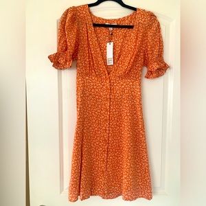 NWT. Never worn. BB Dakota floral sun dress